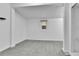 Finished basement area with neutral carpet and a window providing natural light at 1000 S Perry St, Denver, CO 80219