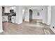 Modern kitchen with stainless steel appliances, subway tile backsplash, and laminate flooring at 1000 S Perry St, Denver, CO 80219