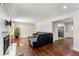 Living room with hardwood floors, fireplace, and view into kitchen at 420 Racine St, Aurora, CO 80011