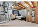 Unfinished basement bedroom with sauna, dresser and laundry area at 3383 Willowrun Dr, Castle Rock, CO 80109