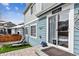 Home exterior with sliding door, blue siding, and manicured lawn at 3383 Willowrun Dr, Castle Rock, CO 80109