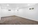 Spacious carpeted basement ready for customization and finishing at 1772 S Pierce St, Lakewood, CO 80232