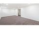 Unfinished basement with neutral carpet awaiting your personal touch at 1772 S Pierce St, Lakewood, CO 80232