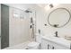 Modern bathroom with tiled shower, sleek fixtures, and ample natural light at 1772 S Pierce St, Lakewood, CO 80232