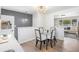 Bright dining area featuring modern lighting and convenient layout at 1772 S Pierce St, Lakewood, CO 80232