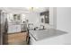 Bright kitchen featuring stainless steel appliances, quartz countertops, with an adjacent eating area at 1772 S Pierce St, Lakewood, CO 80232