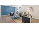 Well-appointed living room with an accent wall and comfortable seating arrangement at 1772 S Pierce St, Lakewood, CO 80232