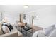 Open-concept living area with comfortable seating, chic decor, and modern flooring at 1772 S Pierce St, Lakewood, CO 80232