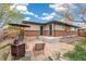 Backyard patio with outdoor seating, barbecue, wooden fence, and brick siding at 1772 S Pierce St, Lakewood, CO 80232