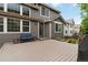 Backyard wooden deck featuring an outdoor seating area with blue cushions at 2828 Shadow Dance Dr, Castle Rock, CO 80109