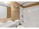 Bathroom featuring a white sink, toilet, and shower with glass shelving at 2828 Shadow Dance Dr, Castle Rock, CO 80109