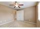Bedroom featuring carpet, a ceiling fan and a closet at 2828 Shadow Dance Dr, Castle Rock, CO 80109