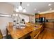Dining area featuring wood table and chairs, open to the kitchen and living room, perfect for Gathering gatherings at 2828 Shadow Dance Dr, Castle Rock, CO 80109