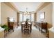 Formal dining room with a large window, neutral carpet, and traditional furniture at 2828 Shadow Dance Dr, Castle Rock, CO 80109