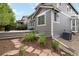 Backyard view of home and outdoor space with mature landscaping at 2828 Shadow Dance Dr, Castle Rock, CO 80109
