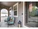 Cozy front porch with chairs, brick accents, and a 'welcome' sign, creating an inviting entry at 2828 Shadow Dance Dr, Castle Rock, CO 80109