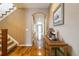 Hallway with hard wood floors and arched doorways leading to other areas of the home at 2828 Shadow Dance Dr, Castle Rock, CO 80109