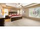 Spacious main bedroom with a ceiling fan and tray ceiling at 2828 Shadow Dance Dr, Castle Rock, CO 80109