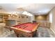 Basement rec room featuring a pool table and a bar at 2828 Shadow Dance Dr, Castle Rock, CO 80109