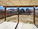 View of fenced backyard from covered patio, highlighting outdoor living potential at 4742 Quandary Peak St, Brighton, CO 80601