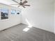 Bright bedroom with ample natural light, featuring neutral carpet and a modern ceiling fan at 4742 Quandary Peak St, Brighton, CO 80601