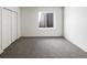 Bedroom featuring a large closet, new carpet, and large window at 4742 Quandary Peak St, Brighton, CO 80601