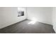 Bedroom featuring a window and plush carpeting at 4742 Quandary Peak St, Brighton, CO 80601