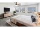 Serene main bedroom featuring plush carpeting, modern furniture, and an abundance of natural light at 4742 Quandary Peak St, Brighton, CO 80601