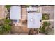 Overhead shot of a home with a well-sized backyard, patio, detached garage, and RV parking spot at 8110 Ivy St, Commerce City, CO 80022