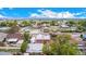 Elevated view of a residence with a yard, detached garage, RV parking spot, and surrounding neighborhood at 8110 Ivy St, Commerce City, CO 80022