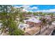 Aerial view capturing the house with a backyard, garage, and RV parking in a neighborhood with trees at 8110 Ivy St, Commerce City, CO 80022