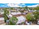 Aerial view of a brick home with backyard, garage, RV parking, and surrounding neighborhood with mature trees at 8110 Ivy St, Commerce City, CO 80022