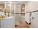 Cozy bathroom featuring a tiled walk-in shower, vanity with sink, decorative elements, and ample lighting at 8110 Ivy St, Commerce City, CO 80022