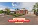 Charming brick home featuring a well-maintained front yard and a detached two-car garage at 8110 Ivy St, Commerce City, CO 80022