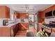 Well-lit kitchen with stainless steel appliances and dark wood cabinetry at 8110 Ivy St, Commerce City, CO 80022