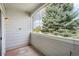 Cozy outdoor balcony with wood-paneled walls, providing an intimate space to enjoy the views at 10259 W 55Th Dr # 103, Arvada, CO 80002
