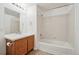 Well-lit bathroom featuring a vanity with ample cabinet space and a shower-tub combination at 10259 W 55Th Dr # 103, Arvada, CO 80002