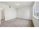 Spacious bedroom with neutral carpet and a window providing ample natural light at 10259 W 55Th Dr # 103, Arvada, CO 80002