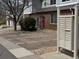 Exterior view of a townhome, showcasing dedicated parking spaces and convenient mailbox access at 10259 W 55Th Dr # 103, Arvada, CO 80002
