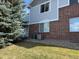 Charming home showcasing a blend of siding and brick, complemented by well-maintained landscaping at 10259 W 55Th Dr # 103, Arvada, CO 80002