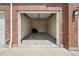 Spacious garage with an open door, offering ample parking and storage space at 10259 W 55Th Dr # 103, Arvada, CO 80002