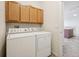 Dedicated laundry room with washer, dryer, and storage cabinets at 10259 W 55Th Dr # 103, Arvada, CO 80002
