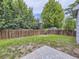 Fenced backyard featuring grass and a concrete patio area at 6447 St Vrain Ranch Blvd, Longmont, CO 80504