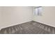 Finished basement room with plush carpet and a window providing natural light at 6447 St Vrain Ranch Blvd, Longmont, CO 80504