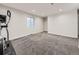 Finished basement room with plush carpet, neutral paint, and a stationary bike at 6447 St Vrain Ranch Blvd, Longmont, CO 80504