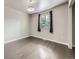 This bedroom features neutral walls and wood floors, with a window providing natural light at 6447 St Vrain Ranch Blvd, Longmont, CO 80504