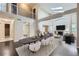 Bright dining room featuring high ceilings, a skylight, and a long table with seating for six at 6447 St Vrain Ranch Blvd, Longmont, CO 80504