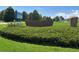 Prairie Ridge Elementary School sign surrounded by green grass and beautiful trees at 6447 St Vrain Ranch Blvd, Longmont, CO 80504