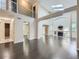 Bright living room with vaulted ceilings, hardwood floors, and a cozy fireplace at 6447 St Vrain Ranch Blvd, Longmont, CO 80504