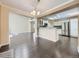 Open-concept living space with hardwood floors and seamless flow to the kitchen area at 6447 St Vrain Ranch Blvd, Longmont, CO 80504